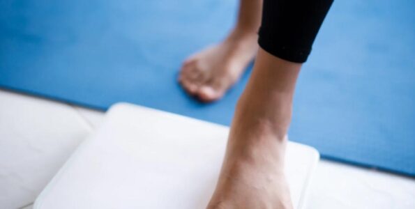 "Person stepping on weighing scale as part of weight loss journey at Dr. Pankti's REVIVE Clinic Borivali - safe inch loss with Ulipolysis, Mesolipolysis and Slim@home."